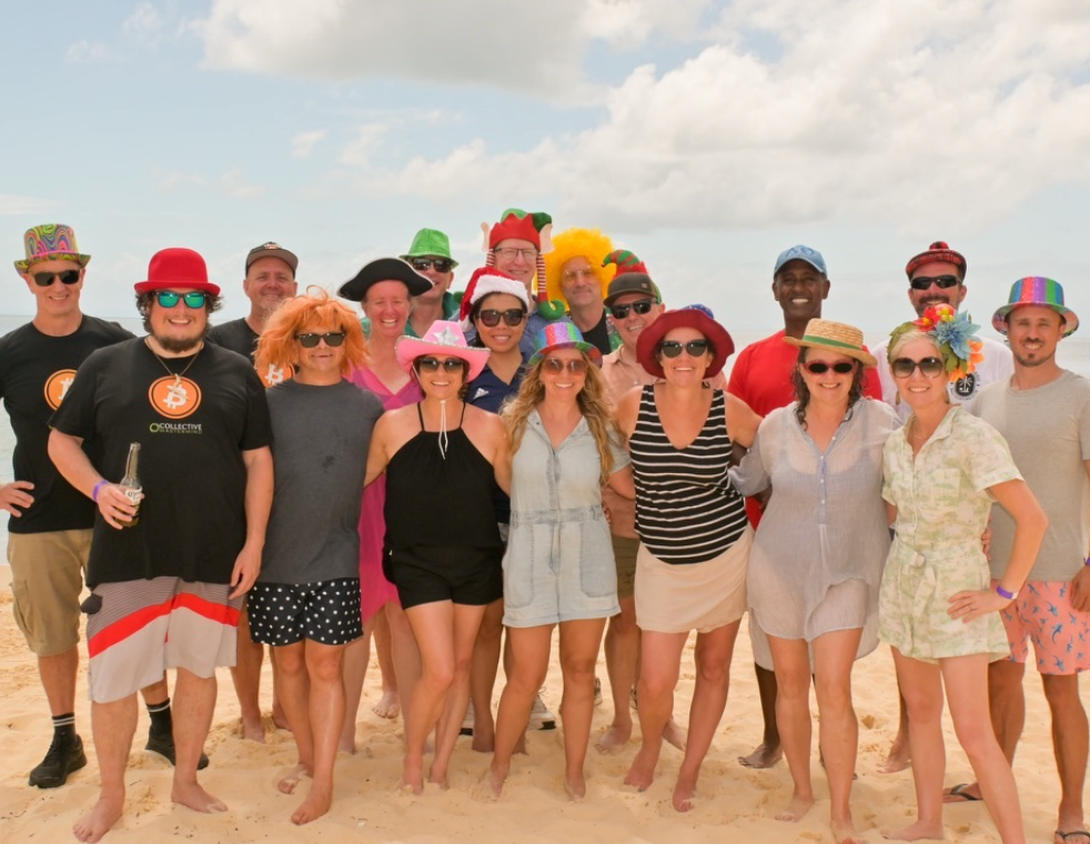 Collective members together on the beach